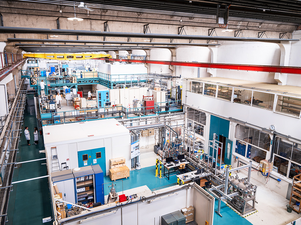 photo of the interior of a factory with lots of devices and pipes